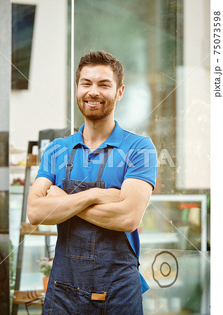Handsome young shop owner Handsome young shop owner 75073598