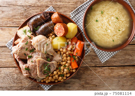 Traditional Spanish Comfort Food at Home Cocido Madrileno close-up on a plate. Horizontal top view 75081114