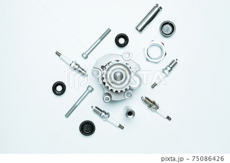 Car service tools. Set of new metal car part. Auto motor mechanic spare or automotive piece isolated on white background. Technology of mechanical gear with space for text. Car service tools. Set of new metal car part. Auto motor mechanic spare or automotive piece isolated on white background. Technology of mechanical gear with space for text. 75086426