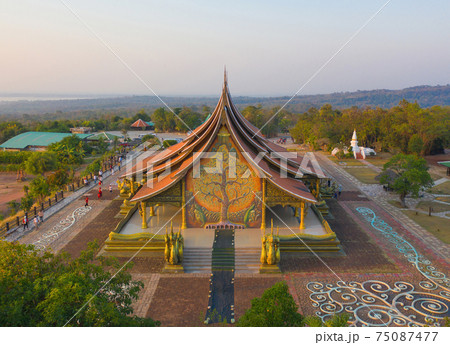 Aerial view of Wat Sirindhorn Wararam or Wat Phu Prao temple in Ubon Ratchathani, Thailand. Buddist temple. Tourist attraction landmark. Aerial view of Wat Sirindhorn Wararam or Wat Phu Prao temple in Ubon Ratchathani, Thailand. Buddist temple. Tourist attraction landmark. 75087477