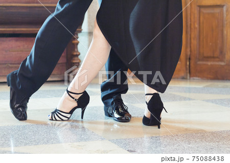Legs of man and woman dancing Argentine tango 75088438