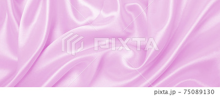 Smooth elegant pink silk or satin texture as wedding background. Luxurious background design Smooth elegant pink silk or satin texture as wedding background. Luxurious background design 75089130