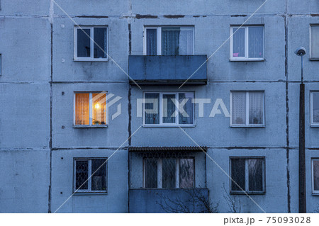Wall of multi-storey residential building with Iluminated window. Wall of multi-storey residential building with Iluminated window. 75093028