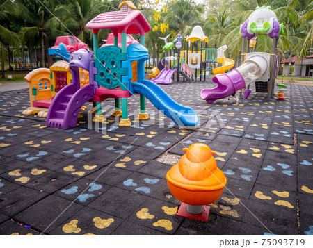 Colorful playground on yard in the park. Colorful playground on yard in the park. 75093719