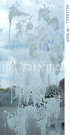 chemical soap, detergent or disinfectant, foam on clear glass. chemical soap, detergent or disinfectant, foam on clear glass. 75093730