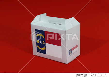 North Carolina flag on white box with barcode and the color of state flag on red background. North Carolina flag on white box with barcode and the color of state flag on red background. 75100787