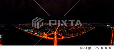 Panorama of night aerial view of the city of Ivano-Frankivsk, bright lights from cars and night lighting of the city. 75101010
