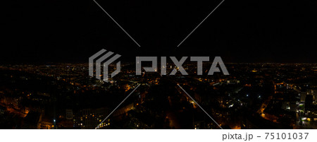 Night city of Lviv, aerial view, illuminated streets and squares of the city. 75101037