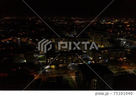 Night city of Lviv, aerial view, illuminated streets and squares of the city. 75101040