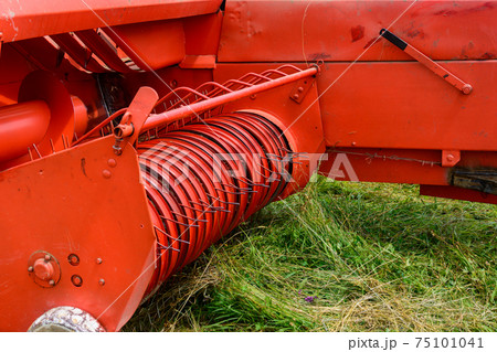 Hay baler close up, rake press and constructing details. 75101041