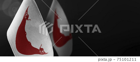 Small national flags of the Easter Island on a dark background Small national flags of the Easter Island on a dark background 75101211