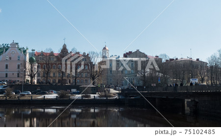 Beautiful houses and a bridge over the river. The city of Vyborg. 75102485