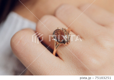 close up of boho styled woman hands with silver jewelry. close up of boho styled woman hands with silver jewelry. 75103251