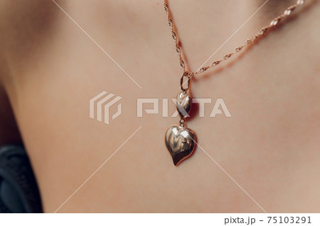 Close up Detail of a Beautiful Necklace in Glamour Shot - Image of a beautiful precious piece around model s neck. Close up Detail of a Beautiful Necklace in Glamour Shot - Image of a beautiful precious piece around model s neck. 75103291