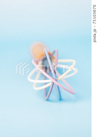Colored plastic whisk for whipping on a blue background, copy space 75103670