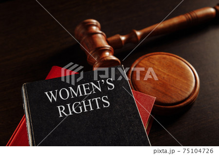 Woman's rights book at the desk. Protecting female concept. 75104726