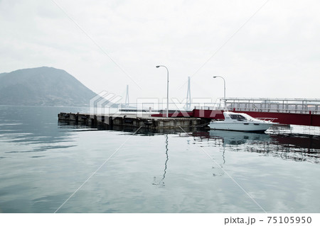 The small port and small vessel anchored 75105950