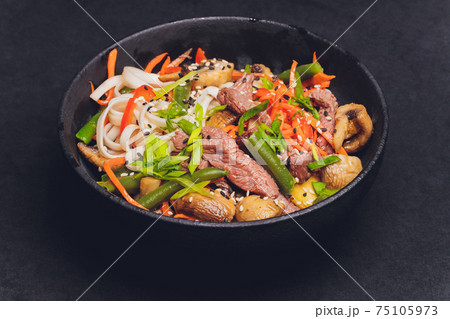 Udon noodles with chicken and peppers - Japanese cuisine. 75105973