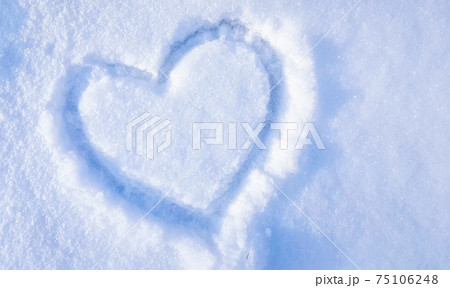 heart drawn on the snow in the park. Valentine's Day, winter vacation in the city heart drawn on the snow in the park. Valentine's Day, winter vacation in the city 75106248