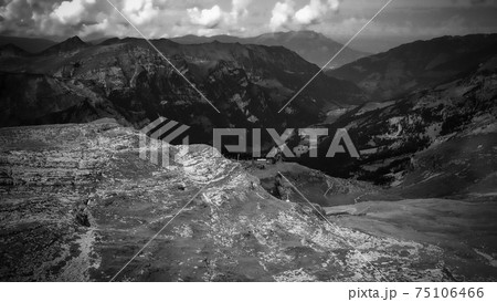 Flight over the wonderful nature of Switzerland - the Swiss Alps in black and white Flight over the wonderful nature of Switzerland - the Swiss Alps in black and white 75106466