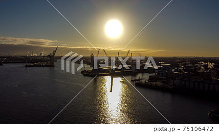 The cranes of Hamburg Harbour in the backlight The cranes of Hamburg Harbour in the backlight 75106472