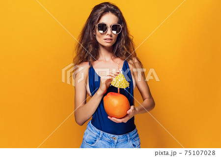 Sensual woman with juicy fruit 75107028