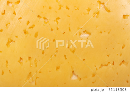 Holes in yellow cheese, background or texture 75113503