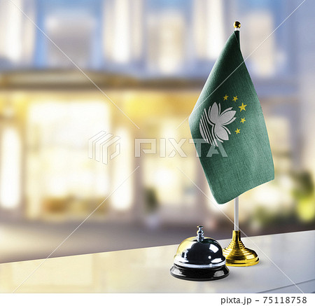 Macao flag on the reception desk in the lobby of the hotel 75118758