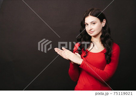 Cheerful woman clapping hands giving an applause Cheerful woman clapping hands giving an applause 75119021