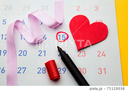 Ovulation date marked on calendar, trying to conceive. Planning of pregnancy concept 75120036