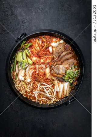 Traditional Korean kimchi jjigae with grilled pork belly and ramen 75122001