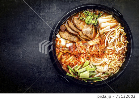 Traditional Korean kimchi jjigae with grilled pork belly and ramen 75122002
