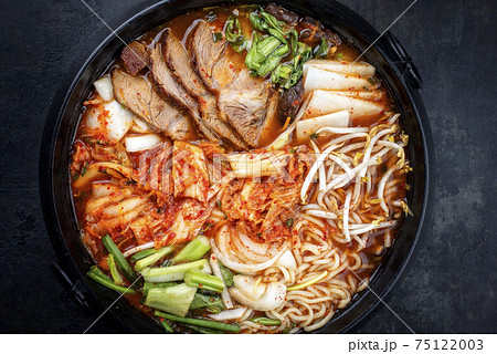 Traditional Korean kimchi jjigae with grilled pork belly and ramen 75122003
