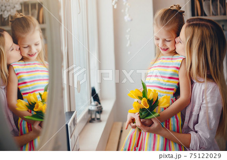 Mother with little child at home 75122029