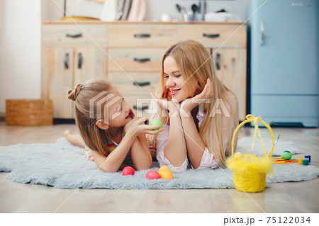 Mother with little daughter in a kitchen 75122034
