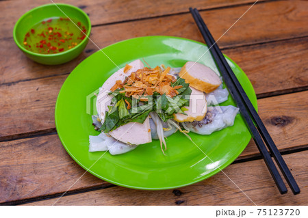Traditional Vietnamese rice noodle rolls topped with fried shallot Traditional Vietnamese rice noodle rolls topped with fried shallot 75123720