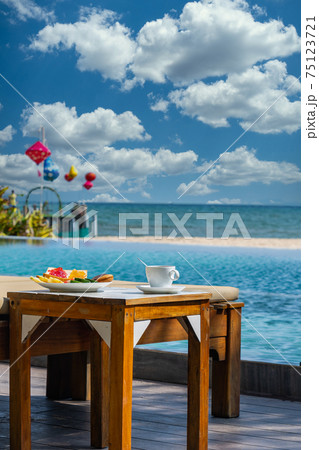Vertical photo of amazing view in the pool in cloudy day 75123721