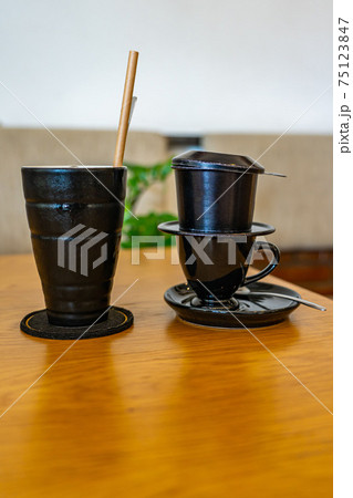 Vietnamese style dripping coffee brewed with metallic filter  75123847