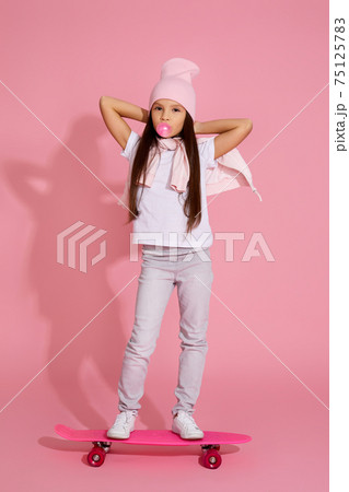 child girl with chewing gum on skateboard child girl with chewing gum on skateboard 75125783