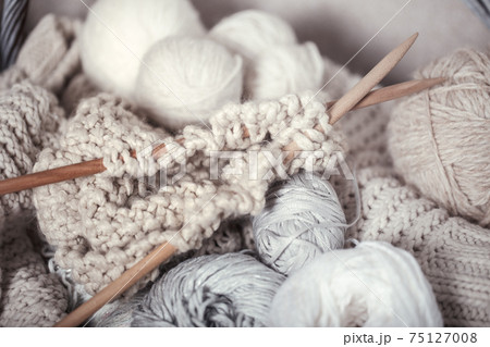 The macro concept of knitting wool and needles The macro concept of knitting wool and needles 75127008