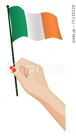 Female hand gently holds small irish flag. Holiday design element. Cartoon vector on white background 75130220