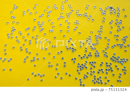 rhinestones on a yellow background, top photo. design for text rhinestones on a yellow background, top photo. design for text 75131324
