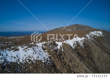 Snow-capped mountains in clouds Beautiful mountain peaks 75132154