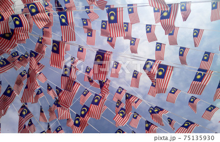 SELANGOR, MALAYSIA -AUGUST 31, 2017: Small size Malaysia flags in windy air. SELANGOR, MALAYSIA -AUGUST 31, 2017: Small size Malaysia flags in windy air. 75135930