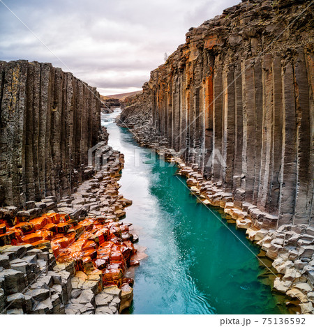 Breathtaking view of Studlagil basalt canyon Breathtaking view of Studlagil basalt canyon 75136592