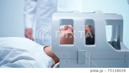 Crop doctor preparing boy for MRI procedure in lab Crop doctor preparing boy for MRI procedure in lab 75138026