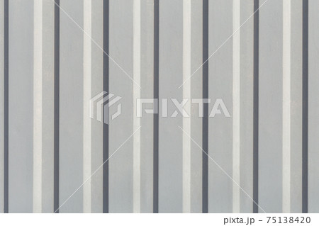 Texture of the wall with gray vertical siding panels in strips 75138420