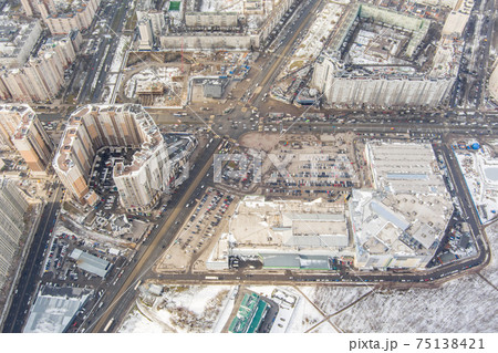 The Aerial view of the huge crossroad at subway station Pioneerskaya, Ispytateley Avenue and Kolomyazhsky, huge houses, developing shopping center, car parking 75138421
