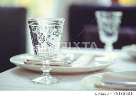 restaurant table setout with white plates and silverware restaurant table setout with white plates and silverware 75138631
