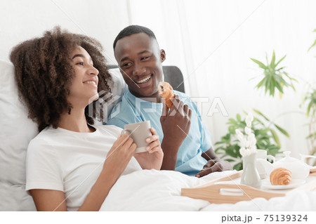 Breakfast in bed together at morning and good mood during covid-19 quarantine Breakfast in bed together at morning and good mood during covid-19 quarantine 75139324